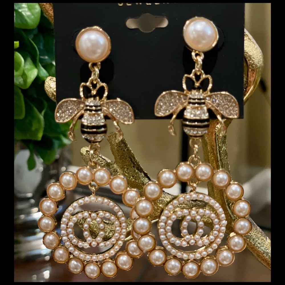 nOir bug  gold platted earrings with pearls.